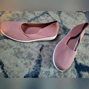Pink pair of flat slip ons